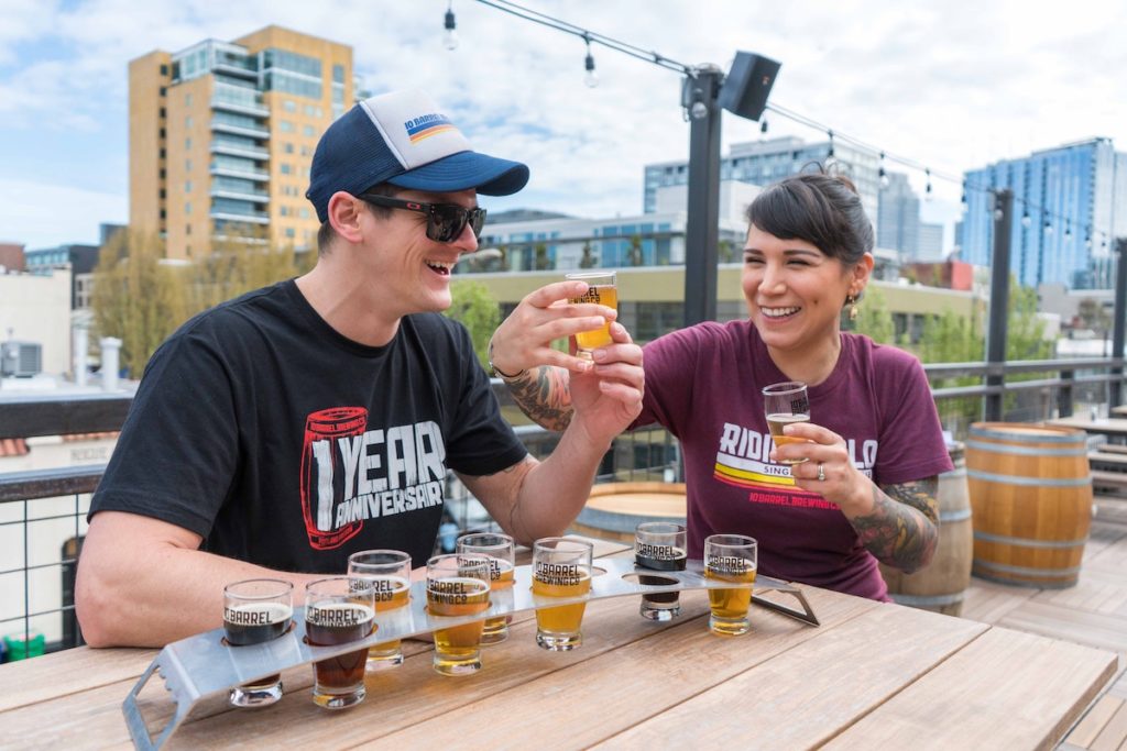 Couple-sharing-a-flight-of-beer